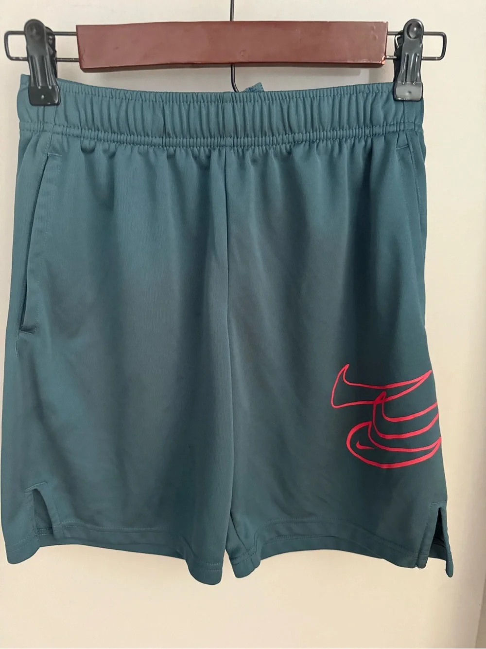 Nike boys Teal Athletic Shorts with coral Swoosh size  medium